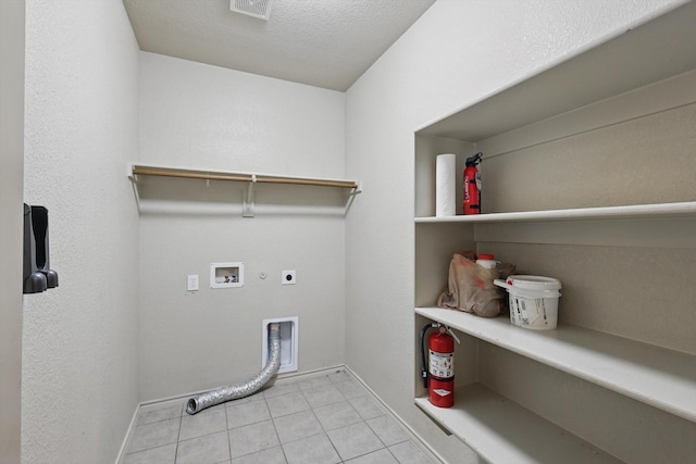 3512 Hornbeam St, Denton, TX 76226 - laundry room featuring hookup for an electric dryer, light tile patterned floors, washer hookup, and hookup for a gas dryer