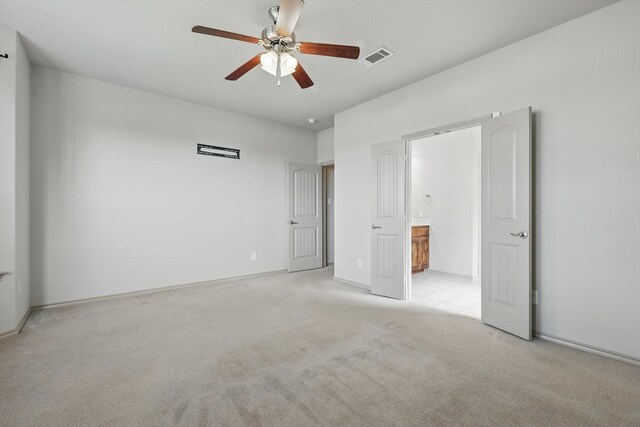 3512 Hornbeam St, Denton, TX 76226 - unfurnished bedroom with light colored carpet, ensuite bath, and a ceiling fan