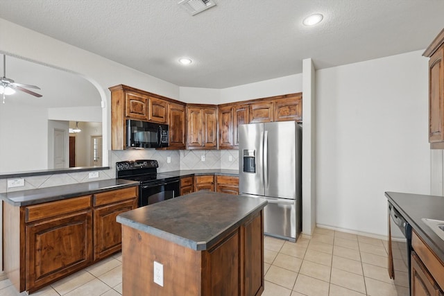 3512 Hornbeam St, Denton, TX 76226 - kitchen featuring black appliances, dark countertops, tasteful backsplash, a ceiling fan, and a textured ceiling