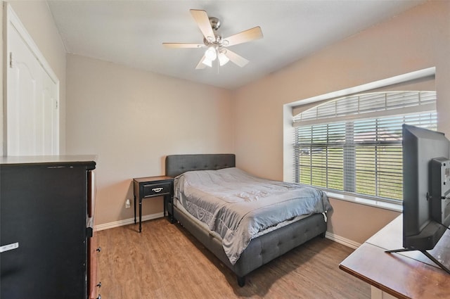 1225 County Road 1021, Burleson, TX 76028 - bedroom with baseboards, wood finished floors, and ceiling fan