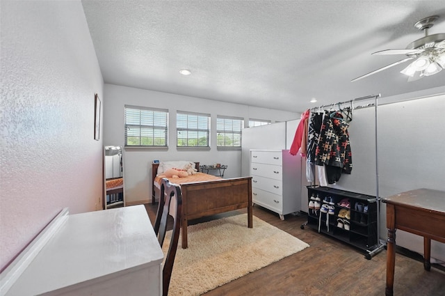 1225 County Road 1021, Burleson, TX 76028 - bedroom featuring dark wood-style flooring, a ceiling fan, a textured ceiling, recessed lighting, and a textured wall