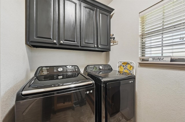1225 County Road 1021, Burleson, TX 76028 - laundry room with separate washer and dryer, cabinet space, and a textured wall
