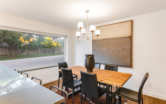 7278 Joyce Way, Dallas, TX 75225 - dining space with a chandelier, baseboards, and dark wood-style flooring