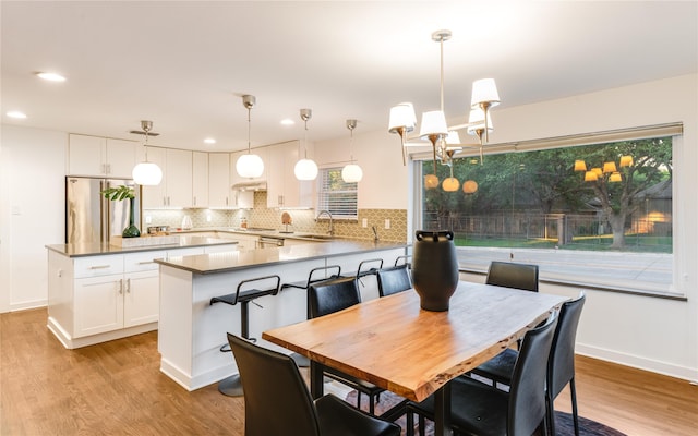 7278 Joyce Way, Dallas, TX 75225 - dining room featuring wood finished floors, recessed lighting, and baseboards