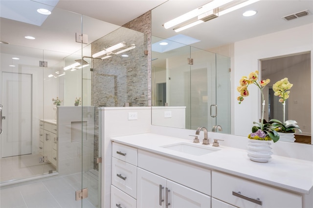 7278 Joyce Way, Dallas, TX 75225 - bathroom featuring vanity, a shower stall, tile patterned flooring, and recessed lighting