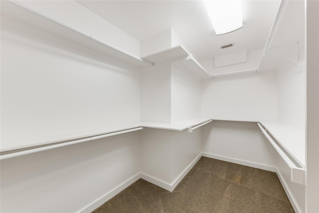 7278 Joyce Way, Dallas, TX 75225 - walk in closet with dark carpet