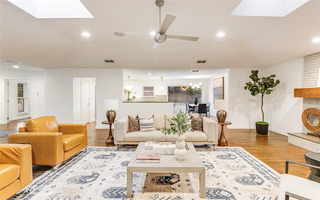 7278 Joyce Way, Dallas, TX 75225 - living room featuring a skylight, ceiling fan, wood finished floors, baseboards, and recessed lighting