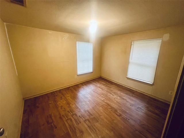 402 N Nash St, Kaufman, TX 75142 - unfurnished room featuring wood finished floors and baseboards