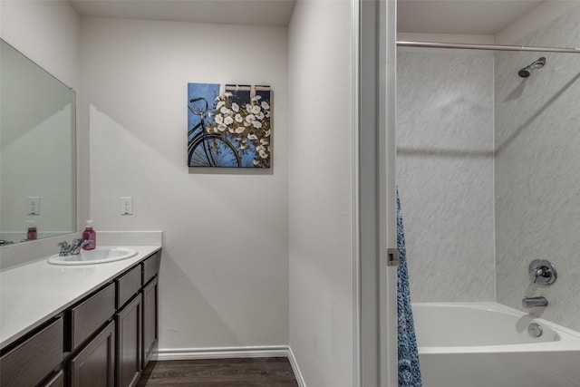 1316 Briar Hill Dr, Denton, TX 76207 - bathroom with vanity, wood finished floors, shower / bath combo, and baseboards