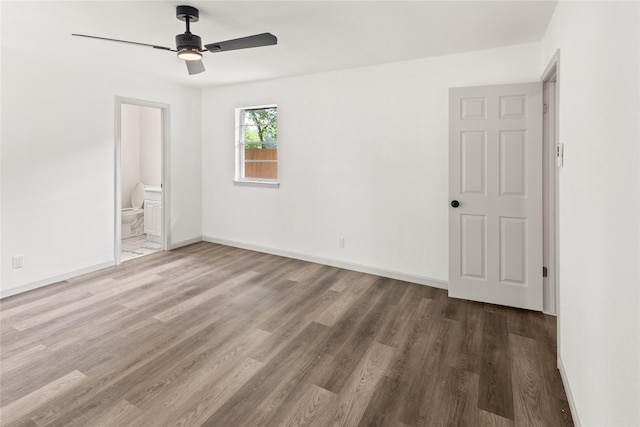 3812 David Ln, Forest Hill, TX 76119 - unfurnished bedroom with wood finished floors, baseboards, ensuite bathroom, and ceiling fan
