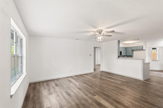 3812 David Ln, Forest Hill, TX 76119 - unfurnished living room featuring wood finished floors, plenty of natural light, and ceiling fan