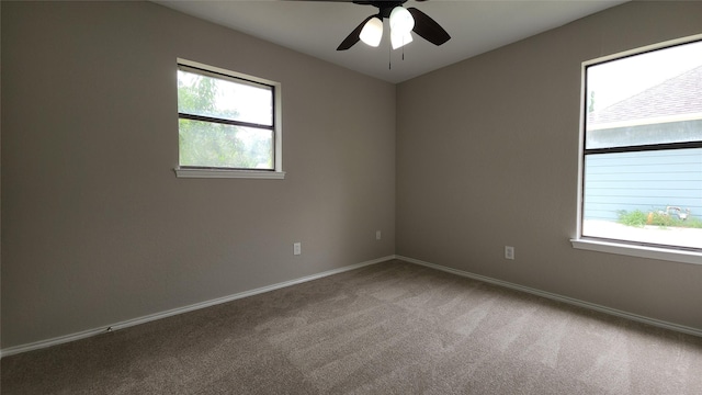 3308 29th St, Fort Worth, TX 76111 - spare room with healthy amount of natural light, carpet floors, ceiling fan, and baseboards