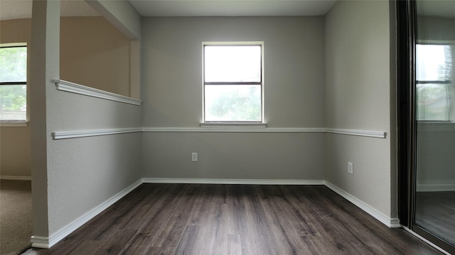 3308 29th St, Fort Worth, TX 76111 - unfurnished room with dark wood finished floors and baseboards