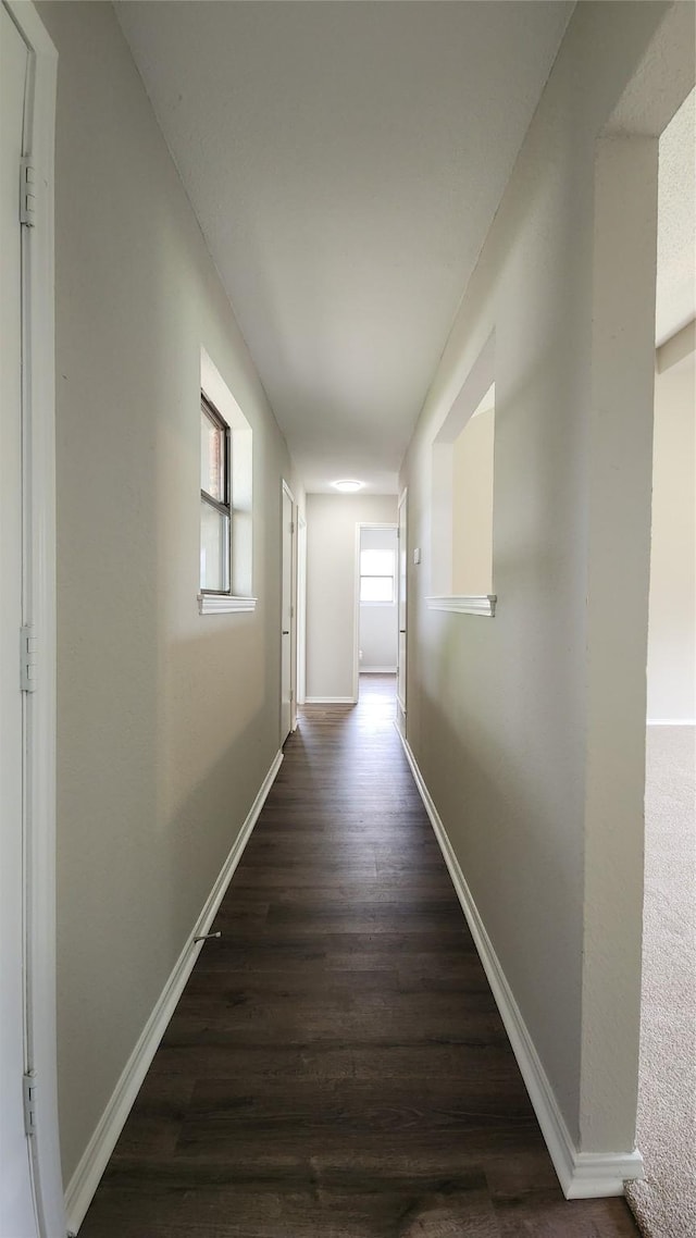 3308 29th St, Fort Worth, TX 76111 - hall featuring dark wood finished floors and baseboards