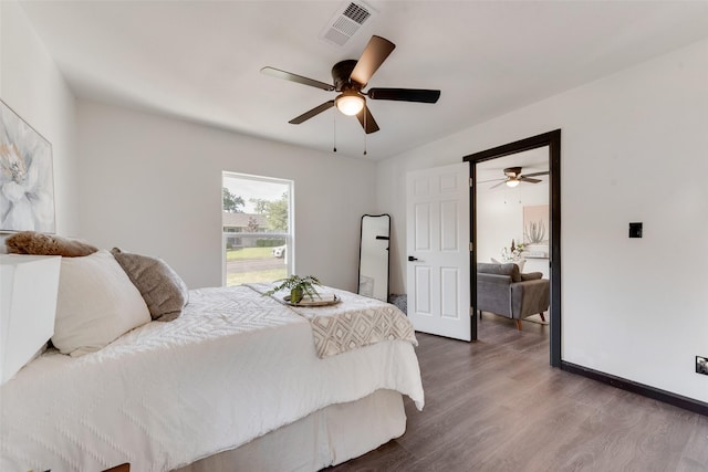 3467 Binyon St, Fort Worth, TX 76133 - bedroom with wood finished floors, ceiling fan, and baseboards