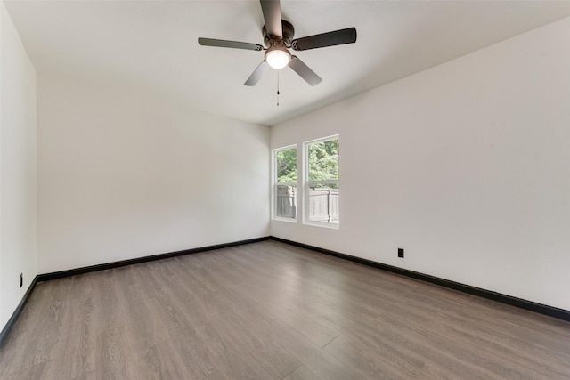 3467 Binyon St, Fort Worth, TX 76133 - unfurnished room with wood finished floors, ceiling fan, and baseboards