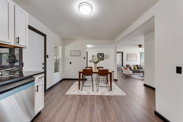 3467 Binyon St, Fort Worth, TX 76133 - dining room with dark wood-type flooring, baseboards, and a ceiling fan