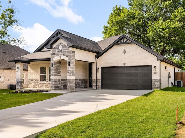 4416 Green Acres Ct, Arlington, TX 76017 - french country style house featuring an attached garage, a front yard, central AC, and driveway