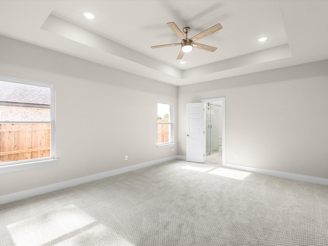 4416 Green Acres Ct, Arlington, TX 76017 - spare room featuring a tray ceiling, baseboards, light colored carpet, ceiling fan, and recessed lighting