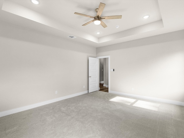 4416 Green Acres Ct, Arlington, TX 76017 - unfurnished room featuring a tray ceiling, carpet flooring, recessed lighting, a ceiling fan, and baseboards