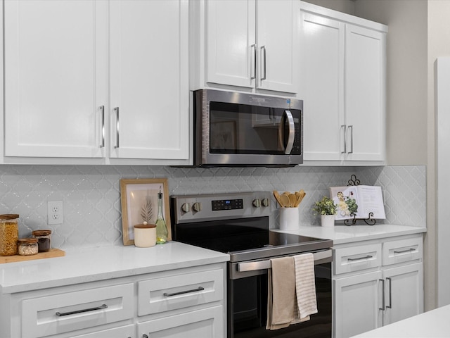 4416 Green Acres Ct, Arlington, TX 76017 - kitchen with stainless steel appliances, white cabinetry, and light countertops
