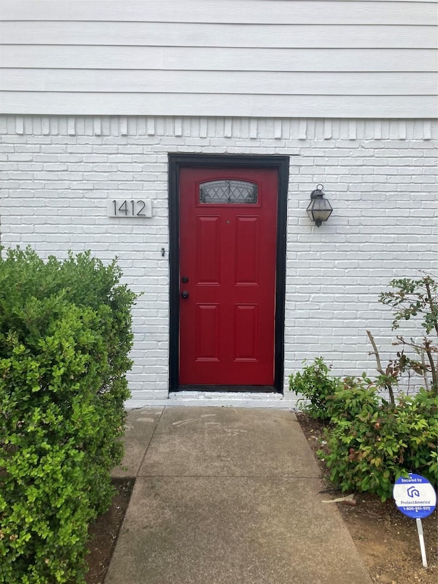 1412 Palmnold Cir E, Fort Worth, TX 76120 - property entrance featuring brick siding