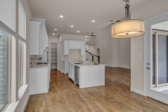 7819 Uxbridge Dr, Irving, TX 75063 - kitchen featuring a sink, stainless steel appliances, white cabinetry, wood finished floors, and recessed lighting