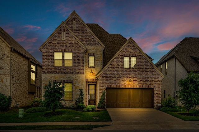 7819 Uxbridge Dr, Irving, TX 75063 - view of front of property featuring brick siding, stone siding, concrete driveway, and a yard