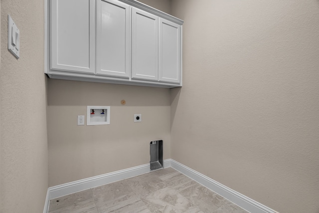 7819 Uxbridge Dr, Irving, TX 75063 - laundry room featuring hookup for an electric dryer, baseboards, hookup for a washing machine, cabinet space, and hookup for a gas dryer
