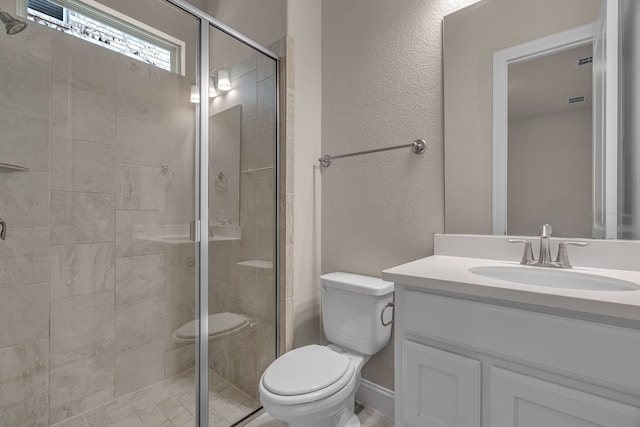 7819 Uxbridge Dr, Irving, TX 75063 - full bath featuring toilet, a shower stall, vanity, and a textured wall