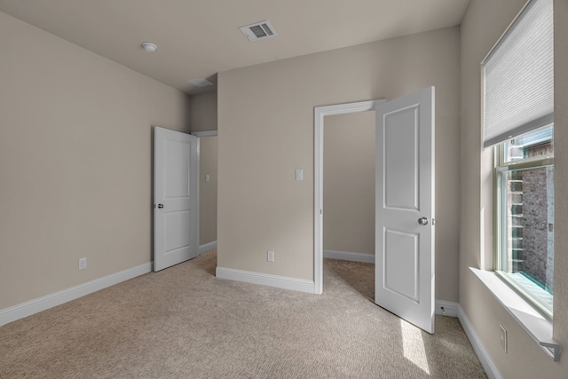 7819 Uxbridge Dr, Irving, TX 75063 - unfurnished bedroom with light colored carpet and baseboards