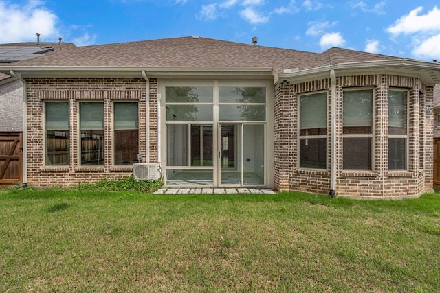 7819 Uxbridge Dr, Irving, TX 75063 - back of house with brick siding, a shingled roof, a lawn, and a cooling unit