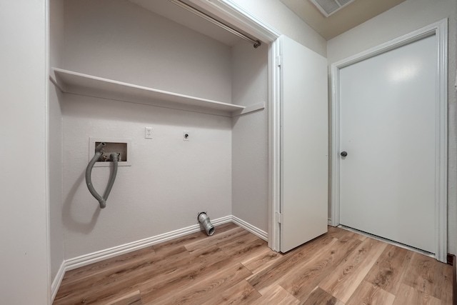 250 E Bancroft Dr, Garland, TX 75040 - laundry room with hookup for an electric dryer, light wood-style flooring, and hookup for a washing machine