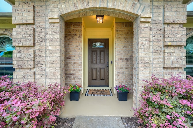 250 E Bancroft Dr, Garland, TX 75040 - doorway to property featuring brick siding