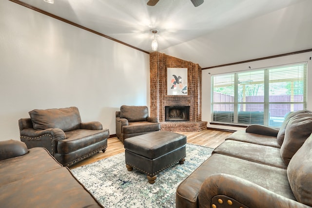 250 E Bancroft Dr, Garland, TX 75040 - living area featuring lofted ceiling, crown molding, wood finished floors, ceiling fan, and a brick fireplace