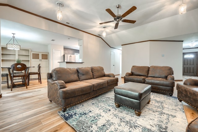 250 E Bancroft Dr, Garland, TX 75040 - living room featuring light wood-type flooring, ceiling fan, ornamental molding, healthy amount of natural light, and lofted ceiling