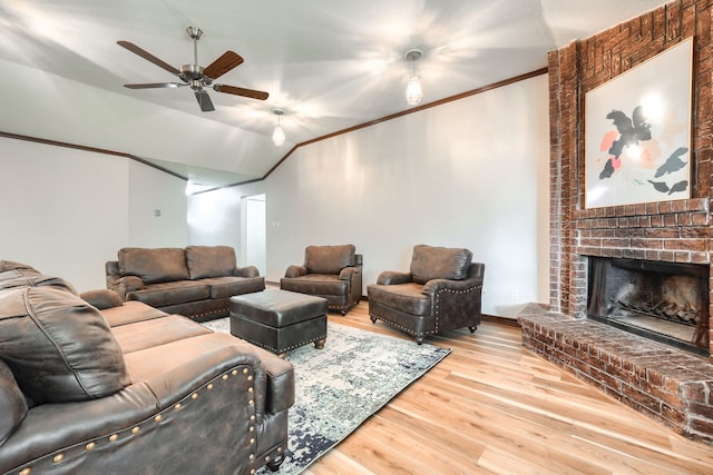 250 E Bancroft Dr, Garland, TX 75040 - living area with a ceiling fan, wood finished floors, a brick fireplace, ornamental molding, and lofted ceiling