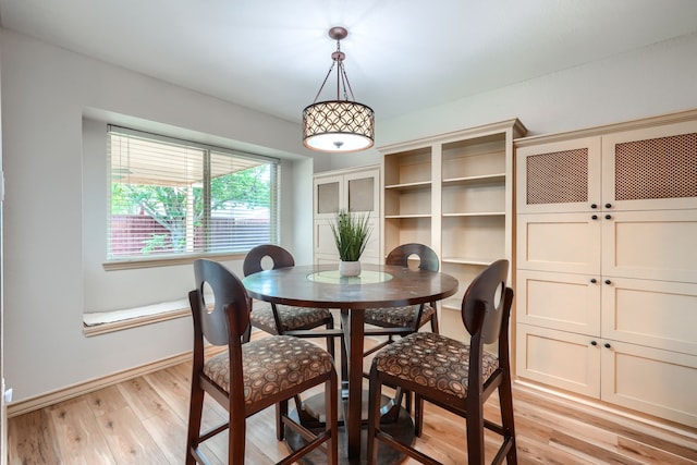 250 E Bancroft Dr, Garland, TX 75040 - dining space featuring light wood-type flooring and baseboards
