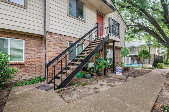 6646 E Lovers Ln Unit 1510, Dallas, TX 75214 - doorway to property featuring brick siding
