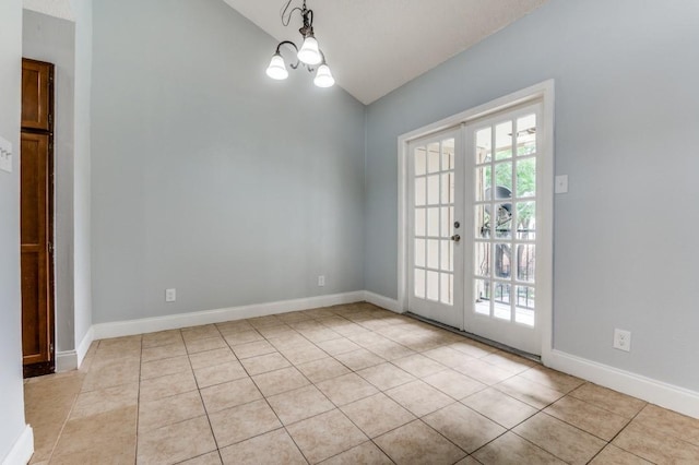 6646 E Lovers Ln Unit 1510, Dallas, TX 75214 - spare room featuring vaulted ceiling, french doors, light tile patterned floors, a chandelier, and baseboards