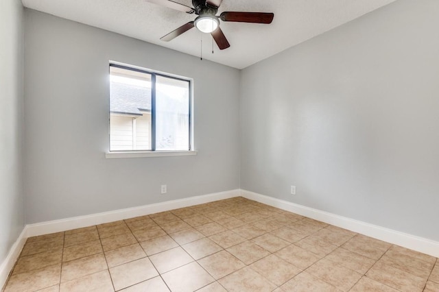 6646 E Lovers Ln Unit 1510, Dallas, TX 75214 - spare room with a ceiling fan, light tile patterned flooring, and baseboards