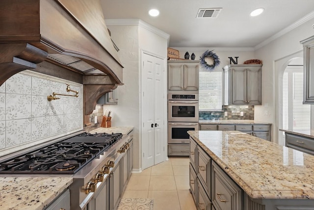 1000 Van Zandt Ct, Haslet, TX 76052 - kitchen with appliances with stainless steel finishes, tasteful backsplash, gray cabinets, recessed lighting, and ornamental molding