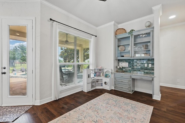 1000 Van Zandt Ct, Haslet, TX 76052 - interior space featuring dark wood-style floors, healthy amount of natural light, built in study area, baseboards, and ornamental molding