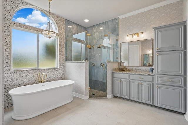 1000 Van Zandt Ct, Haslet, TX 76052 - bathroom featuring a stall shower, a chandelier, a freestanding tub, and vanity