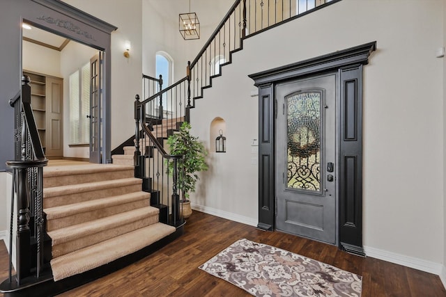 1000 Van Zandt Ct, Haslet, TX 76052 - foyer featuring baseboards, stairs, dark wood-style flooring, healthy amount of natural light, and a towering ceiling