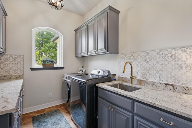 1000 Van Zandt Ct, Haslet, TX 76052 - laundry area with washer and clothes dryer, cabinet space, light tile patterned floors, and baseboards
