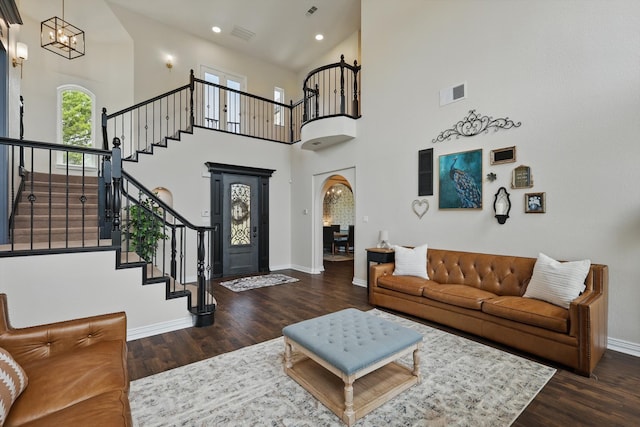 1000 Van Zandt Ct, Haslet, TX 76052 - living room with baseboards, wood finished floors, a chandelier, stairs, and a towering ceiling