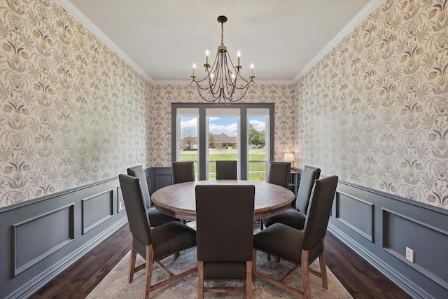 1000 Van Zandt Ct, Haslet, TX 76052 - dining room featuring wood finished floors, wallpapered walls, crown molding, a chandelier, and a wainscoted wall