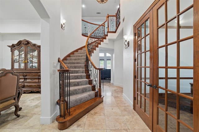 2056 Willow Bend Dr, Oak Leaf, TX 75154 - foyer entrance featuring french doors, baseboards, stairway, a high ceiling, and arched walkways