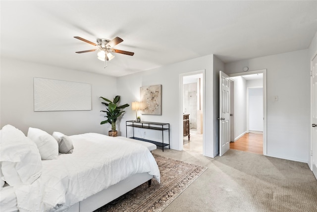 3309 Citation Dr, Dallas, TX 75229 - bedroom featuring light carpet, ensuite bath, a ceiling fan, and baseboards